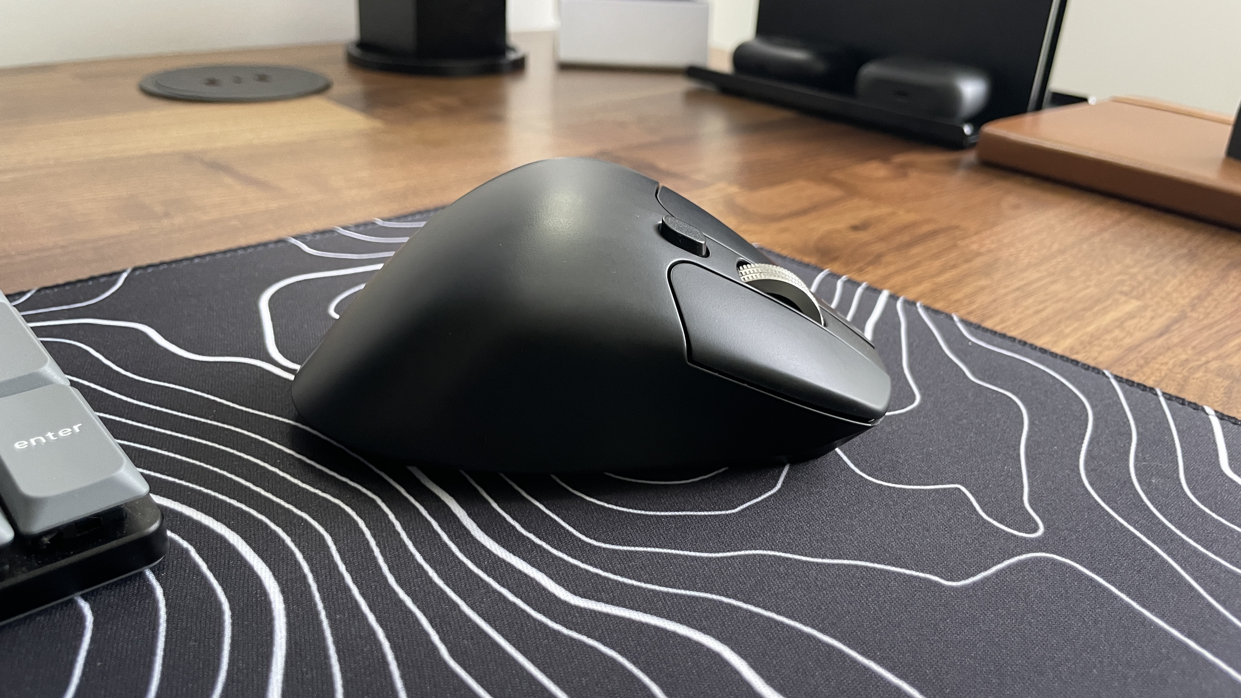 Keychron M6 wireless mouse on a topographic desk mat
